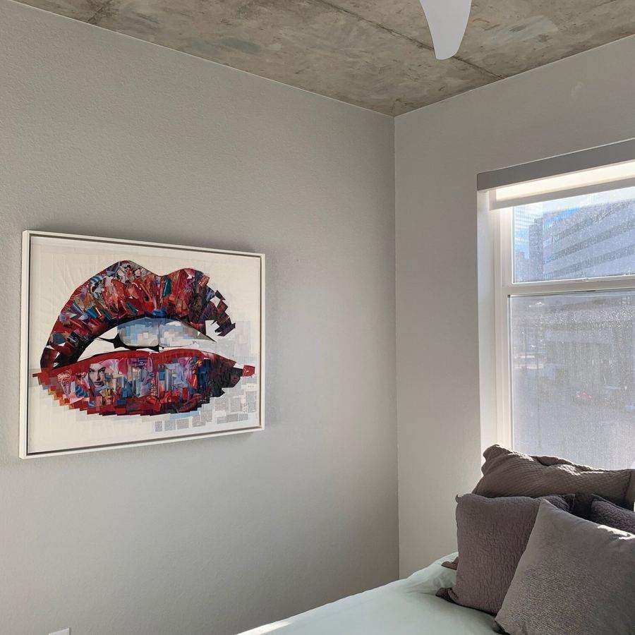Framed lips collage in a bedroom