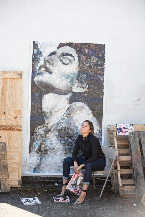 Whitney in the studio with a large collage